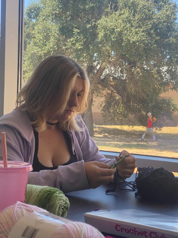 Crochet Club member crocheting during Falcon Club time (Natalie Adkins)