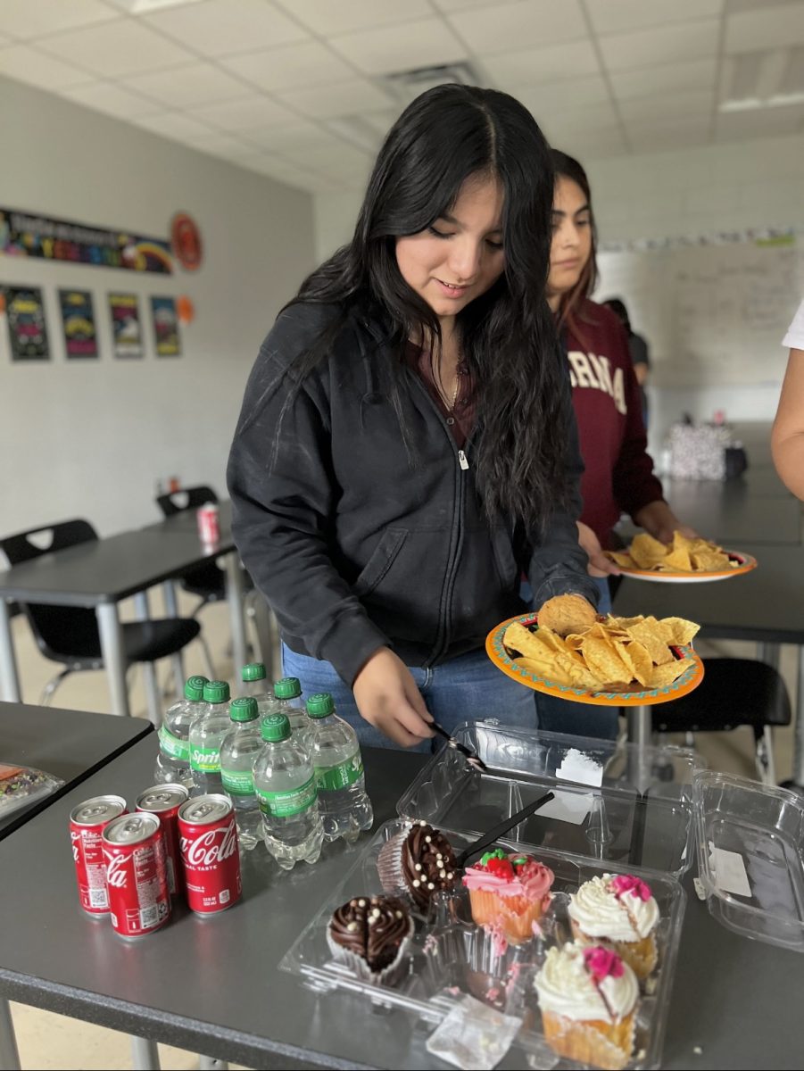 Marisol Aguilar making a plate during the Spanish Club meeting.