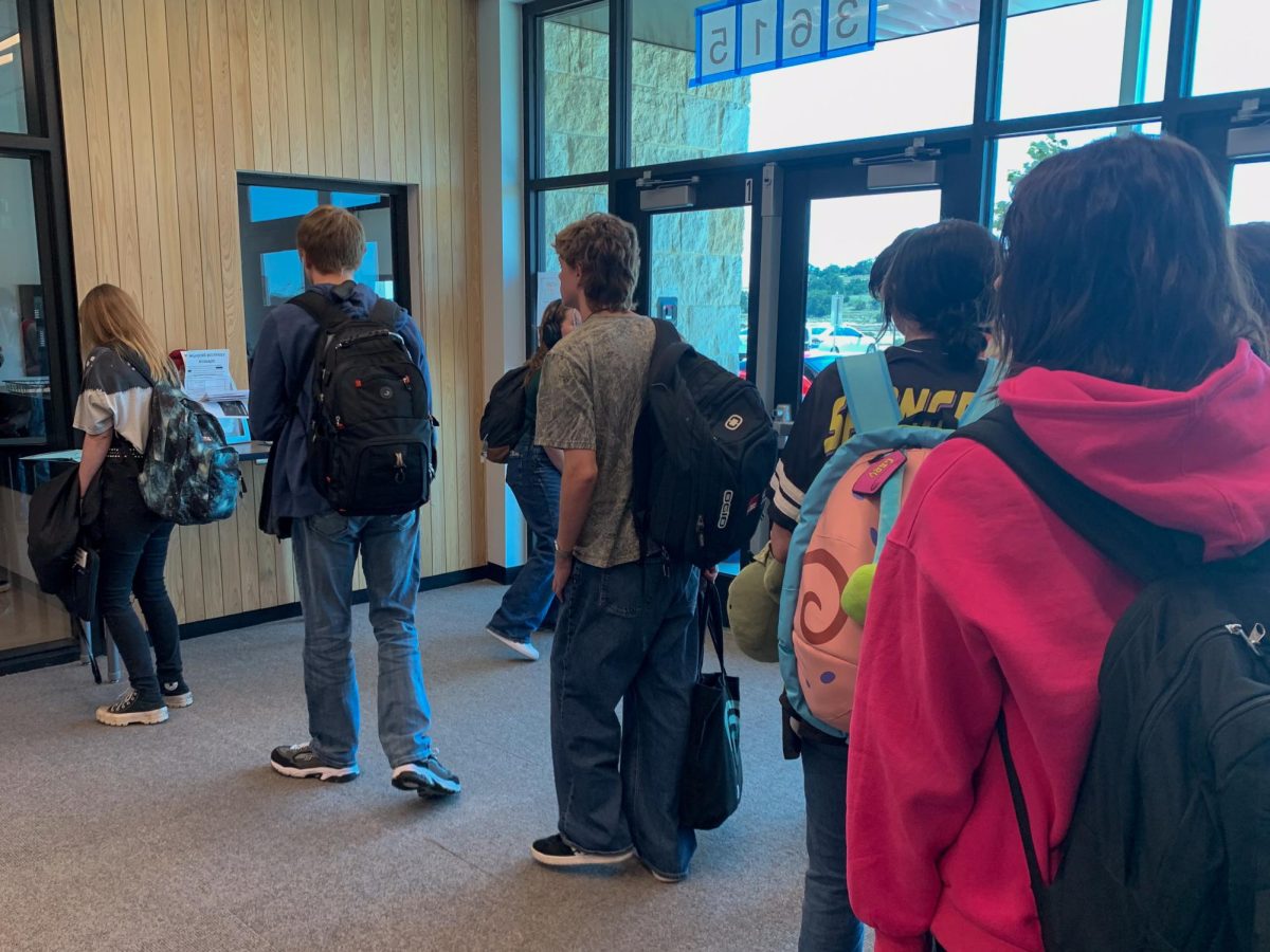 Seniors wait in line to sign out for off-period. 