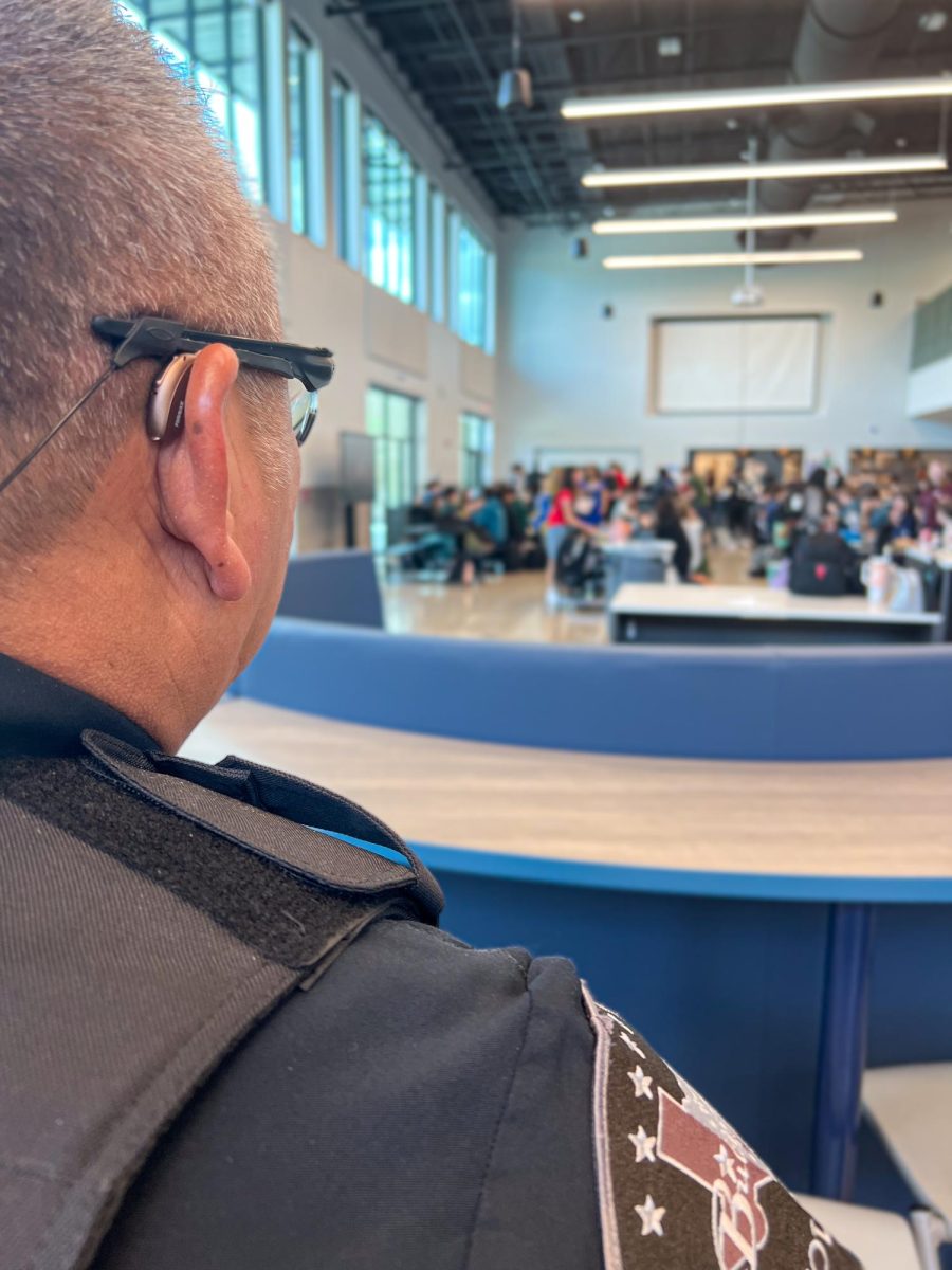 SRO Marquez watches over students in cafeteria.