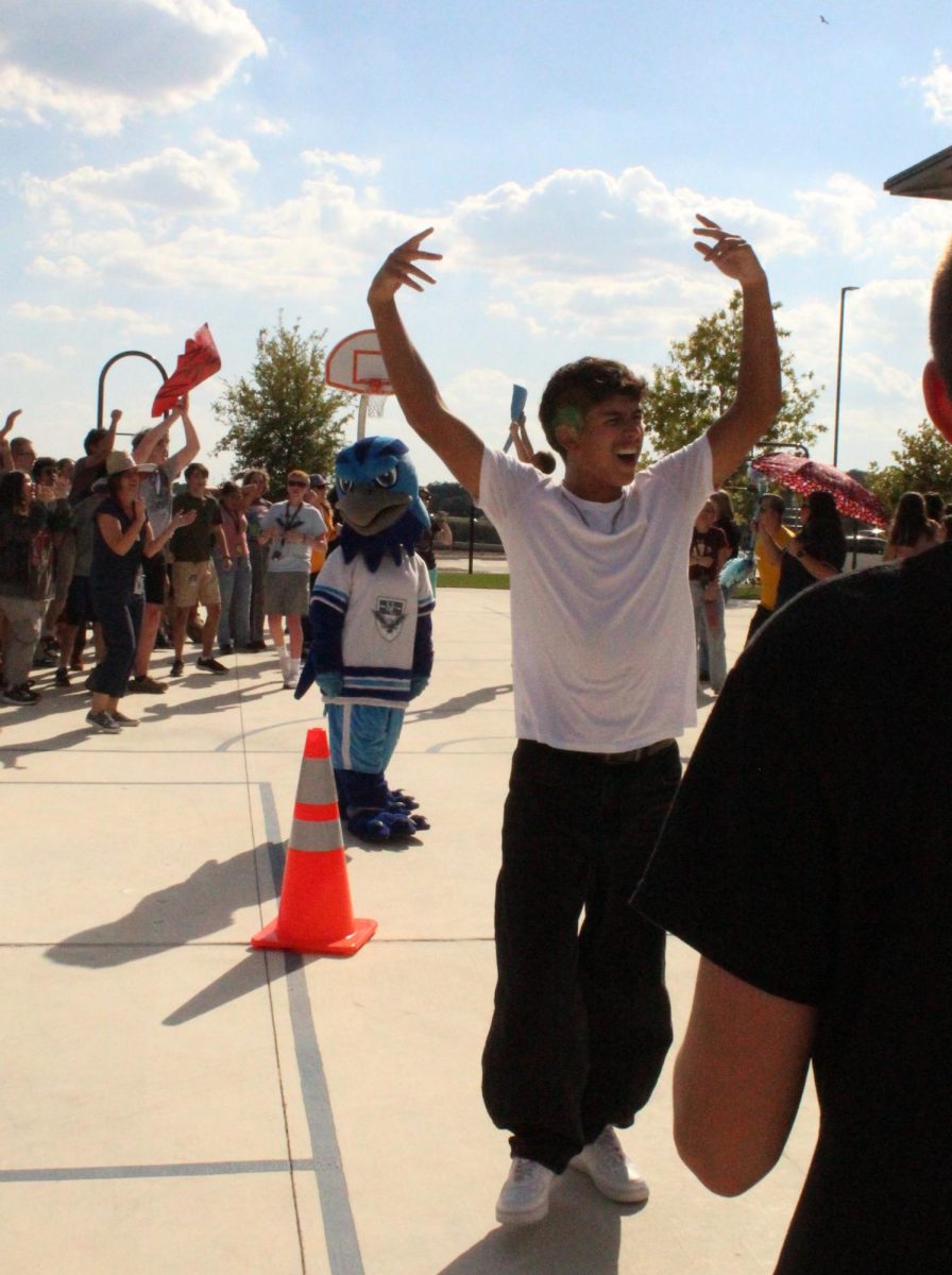 Photo of Sophomore Kai Madrigal, hyping up his classmates for the spirit stick challenge during the pep rally on Wednesday, October 1st.