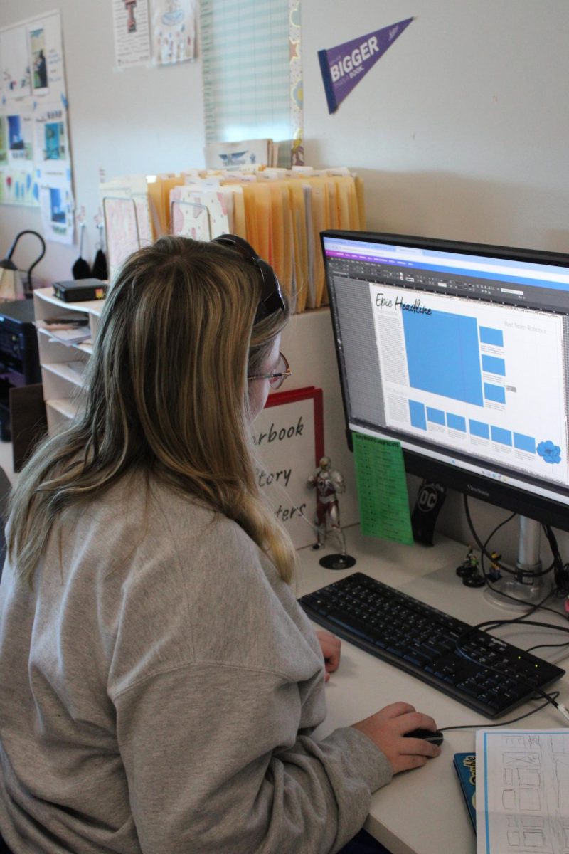 Senior Katarina Topping hard at work designing pages of the yearbook.