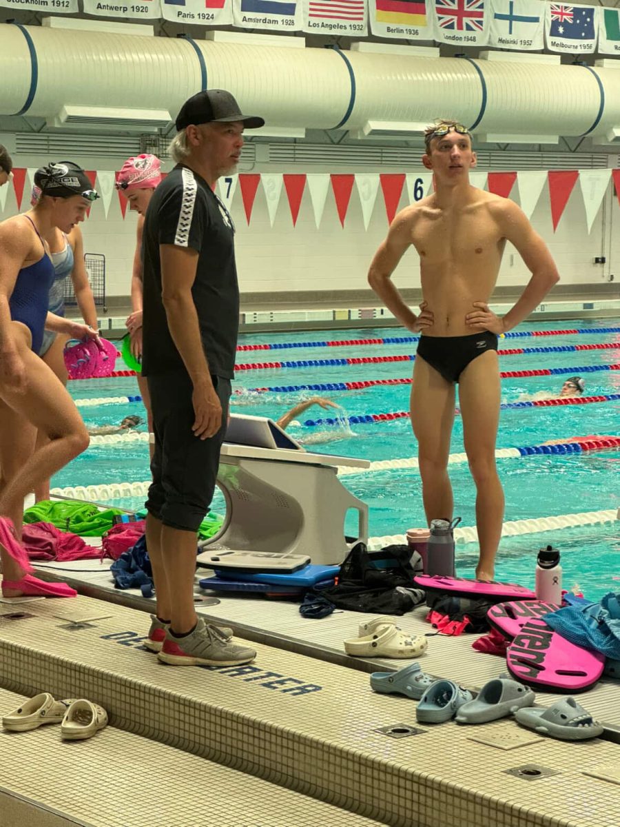 Senior Kai Anderson competing at a swim meet.