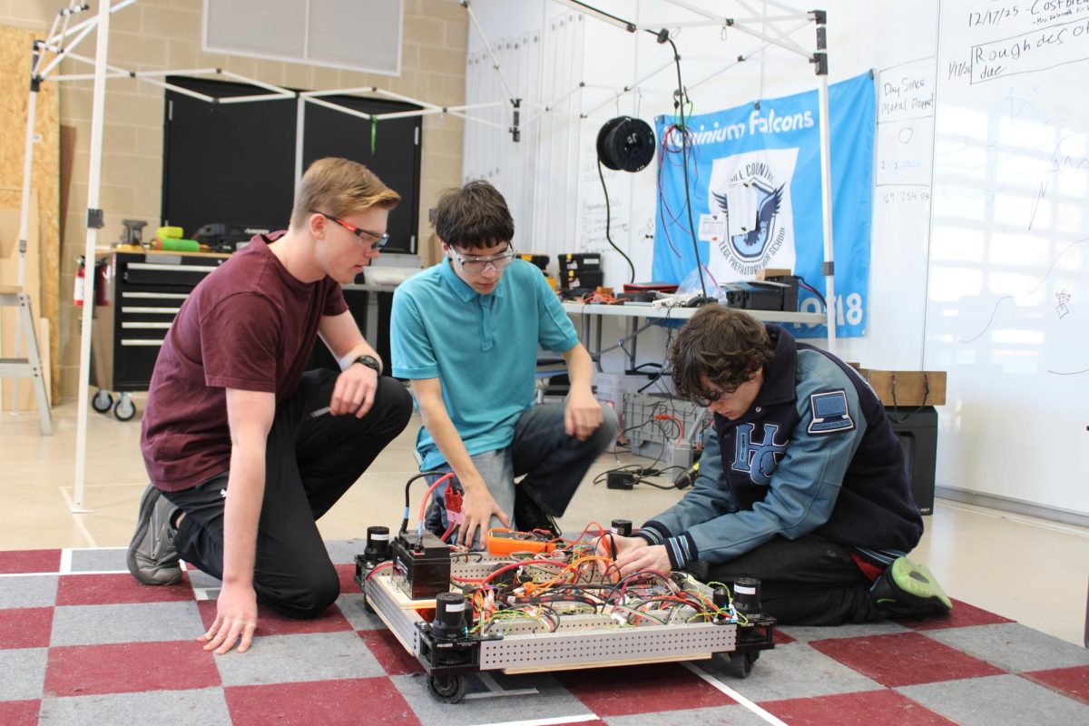 FRC members Collin Gleinser, Brennan McKee and Ty Fonseca working on this year’s robot.