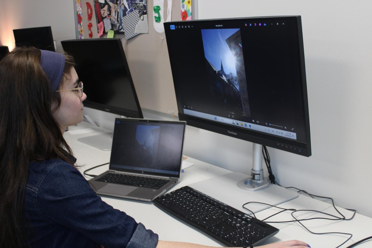 Junior Makrina Hawk works on the Technological Student Association (TSA) photography submission for regional competition. Photo by Brylie Martin

