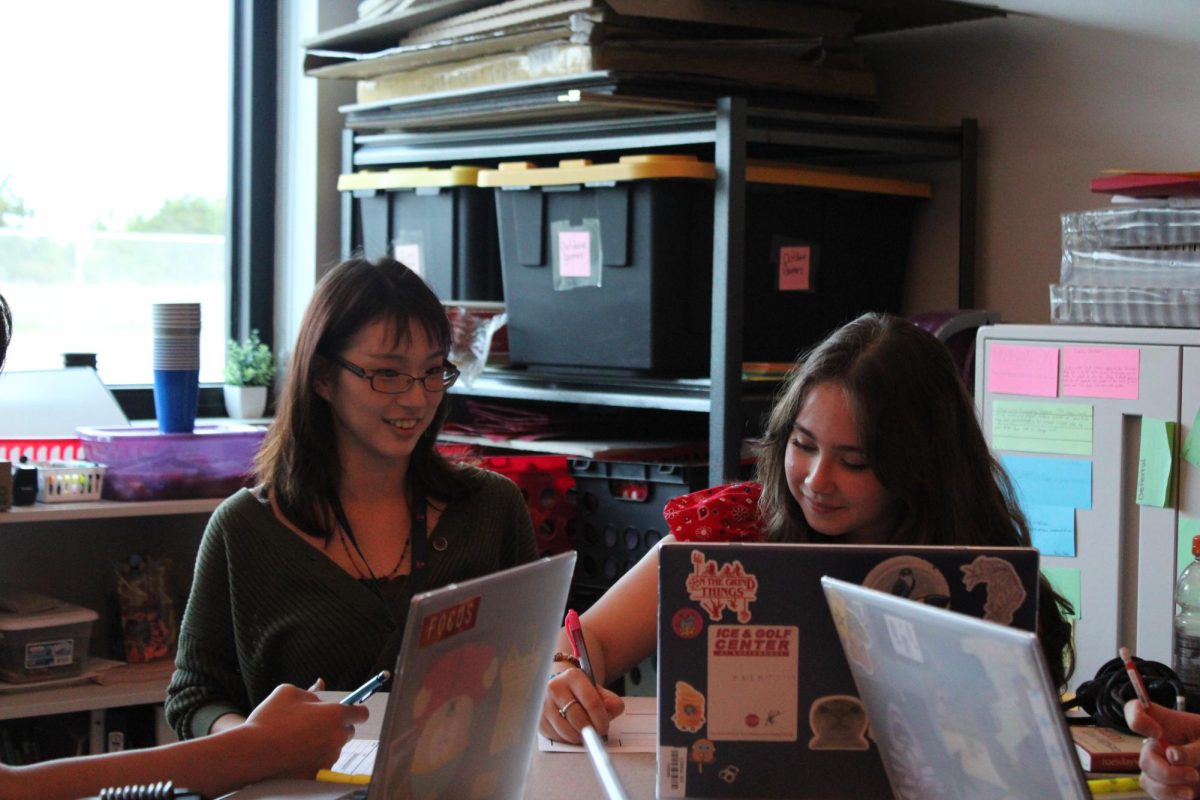 AVID Tutor Riley Tanaka discussing with freshman Emma Treviño about an assignment. Photo by Diana Lopez
