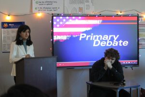 Seniors Michelle Linares-Moreno and Benjamin Corson acting as candidate and moderator respectively during the primary debate for their project in AP Government. Photo by Kylie Trexler